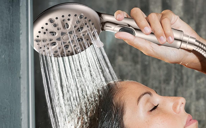 A Woman Using the Cobbe High Pressure 9 Function Shower Head