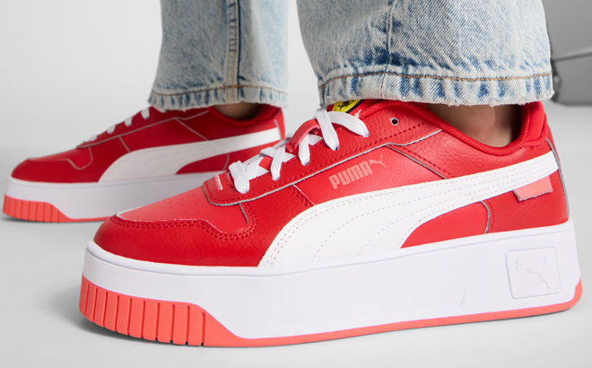 A Woman Weaing Puma Scuderia Ferrari Carina Street Shoes A Woman Weaing Puma Scuderia Ferrari Carina Street Shoes