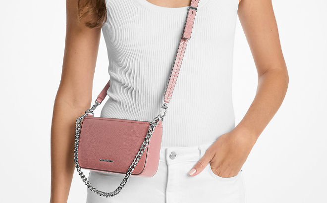 A Woman Wearing Michael Kors Bryant Small Pebbled Leather Convertible Pochette