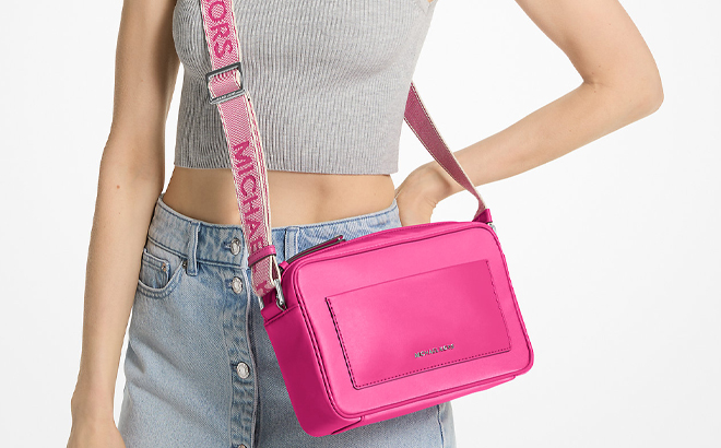 A Woman Wearing Michael Kors Jet Set Large Nylon Gabardine Crossbody Bag