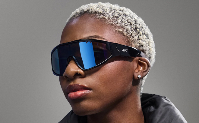 A Woman Wearing Reebok Voltage Smart Audio Sunglasses A Woman Wearing Reebok Voltage Smart Audio Sunglasses
