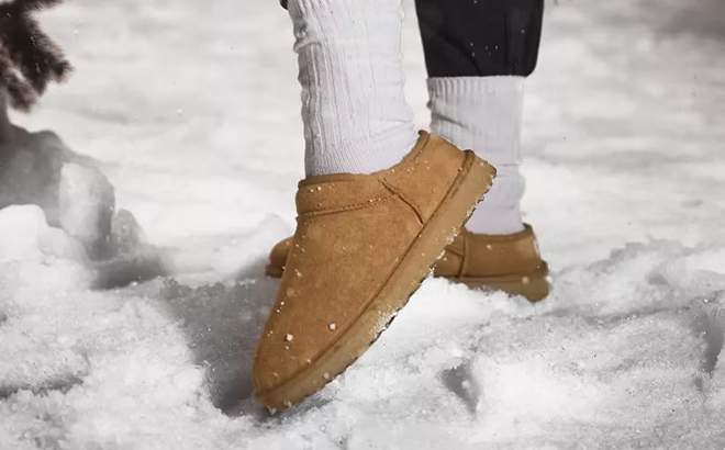 A Woman Wearing UGG Classic Slippers in Cognac