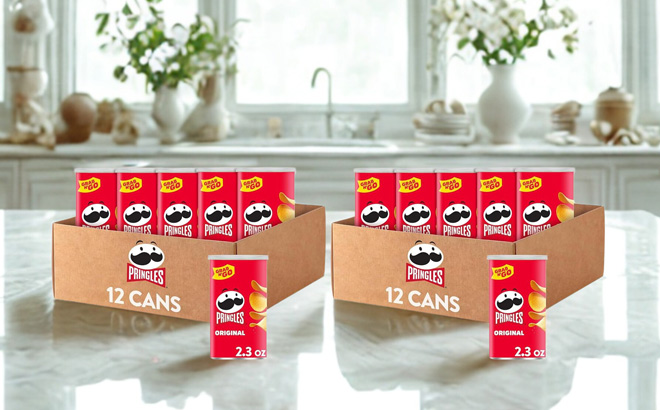 Boxes of Pringles Potato Crisps Chips on a Table