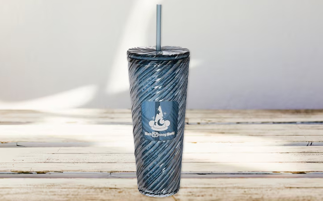 Disney 24 Ounce Mickey Mouse Sorcerers Apprentice Starbucks Travel Tumbler on a Table