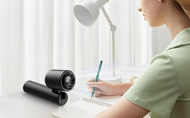 Duomiy Portable Handheld Turbo Fan on a Table