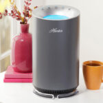 Hunter HP125 AirX True HEPA Digital Air Purifier on a Table in Silver