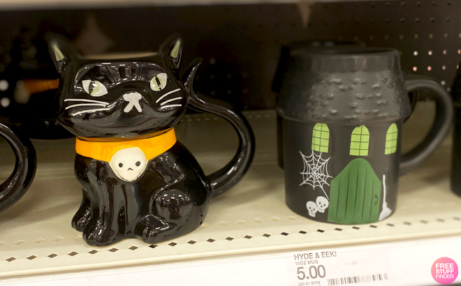 Hyde EEK Figural Black Cat Mug and Figural Haunted House Mug on a Store Shelf Hyde EEK Figural Black Cat Mug and Figural Haunted House Mug on a Store Shelf