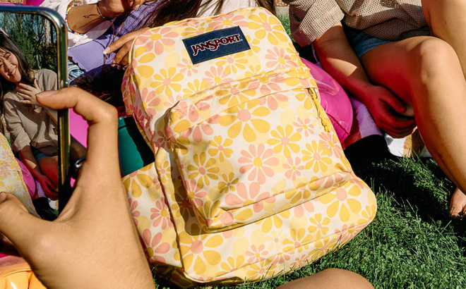 JanSport Superbreak Plus Backpack in Skip Daisy Yellow Color