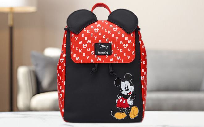 Loungefly Disney Mickey Mouse Ears Slouch Mini Backpack on a Table