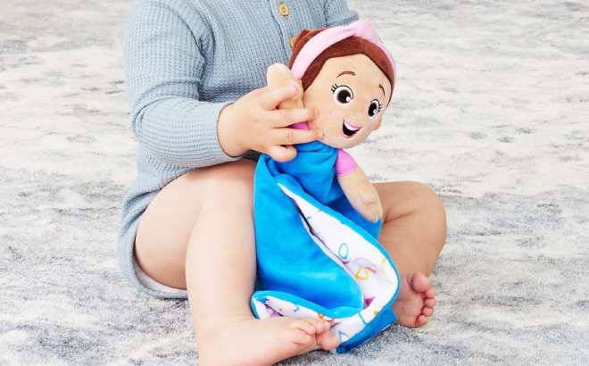 A Baby Holding Ms Rachel Official Huggable Lovey