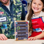 A Child and a Man Making a Letter Box