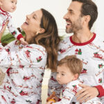 A Family Wearing The Childrens Place Matching Santa Sleigh Cotton Pajamas