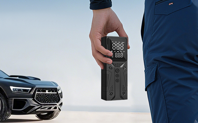 A Hand holding an Airsure Portable Tire Inflator