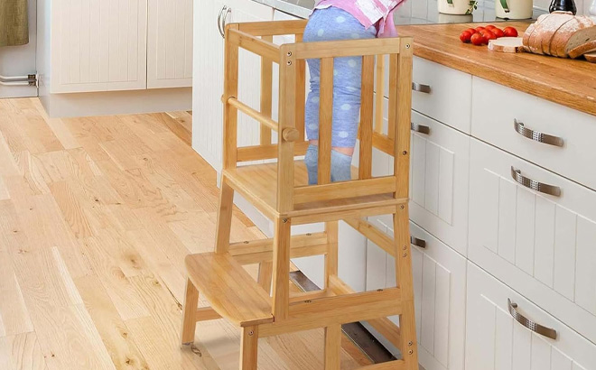 A Kid Standing on Cosyland Kids Kitchen Step Stool