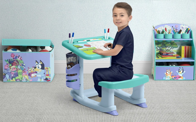 A Kid Using the Delta Children Bluey 3 Piece Art Play Toddler Room in a Box A Kid Using the Delta Children Bluey 3 Piece Art Play Toddler Room in a Box