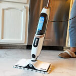 A Person Cleaning with a Steam Mop