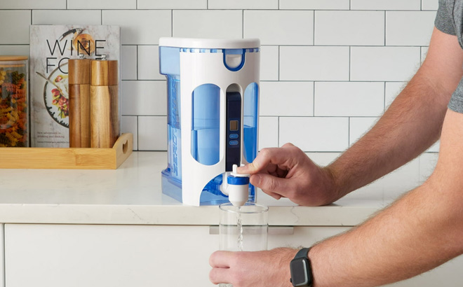 A Person Getting Drinking Water from a ZeroWater Filter Pitcher