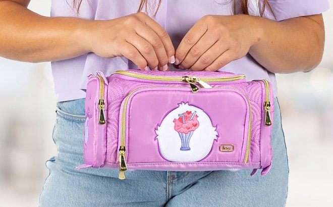 A Person Holding Care Bears x Lug Cosmetic Case in Share Bear Color
