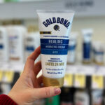 A Person Holding Gold Bond Healing Skin Therapy Lotion