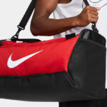 A Person Holding Nike Brasilia 9 5 Training Duffel Bag