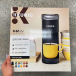 A Person Holding a Keurig K Mini Coffee Maker