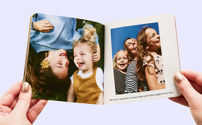 A Person Holding a Photobook A Person Holding a Photobook