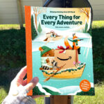 A Person Holding an Amazons 2025 Toy Catalog