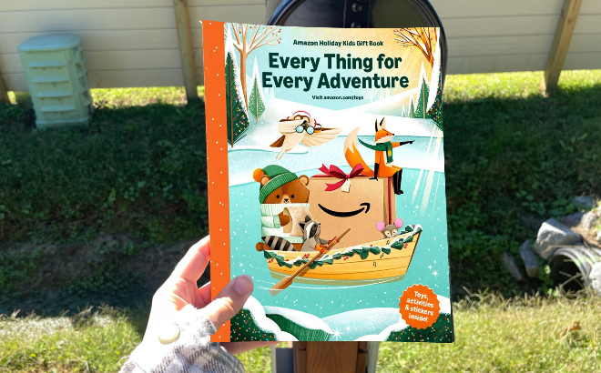 A Person Holding an Amazons 2025 Toy Catalog