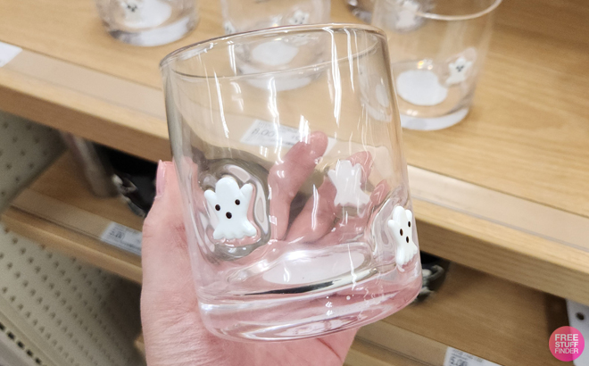 A Woman Holding Hyde Eek Halloween Ghost Icon Glass