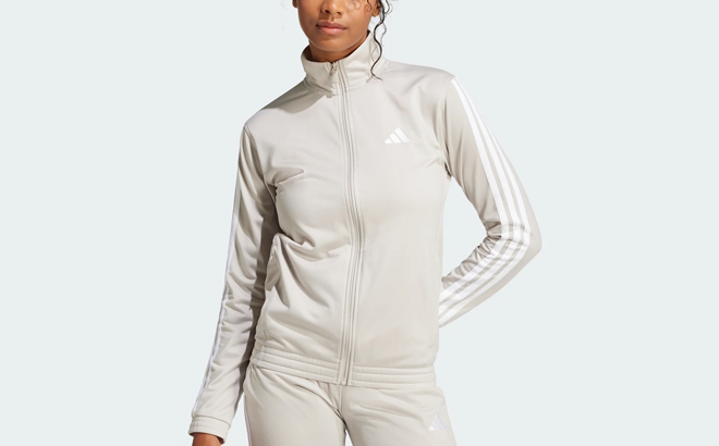 A Woman Wearing Adidas Tricot 3 Stripes Track Jacket