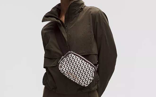 A Woman Wearing Lululemon L Monogram Knit Everywhere Belt Bag 1L A Woman Wearing Lululemon L Monogram Knit Everywhere Belt Bag 1L