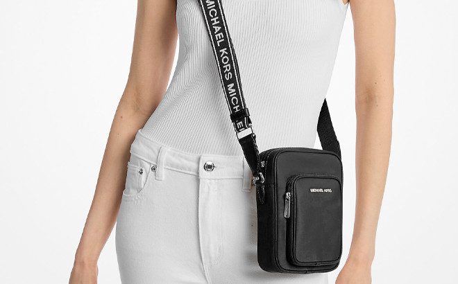 A Woman Wearing Michael Kors Jet Set Khai Nylon Crossbody Bag A Woman Wearing Michael Kors Jet Set Khai Nylon Crossbody Bag