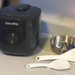 Rice Cooker next to Tools on a Kitchen Countertop