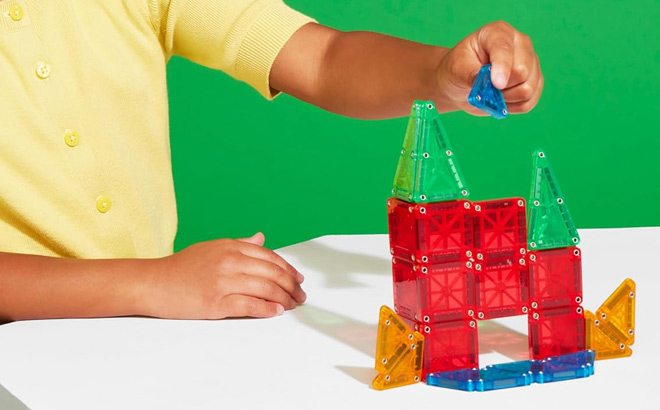 A Child Playing with Magna Tiles microMAGS 26 Piece Travel Construction Set A Child Playing with Magna Tiles microMAGS 26 Piece Travel Construction Set