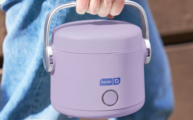 A Person Holding Dash Hot2Go Personal Food Warmer A Person Holding Dash Hot2Go Personal Food Warmer