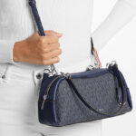 A Person Holding Michael Kors Cecily Small Signature Logo Shoulder Bag