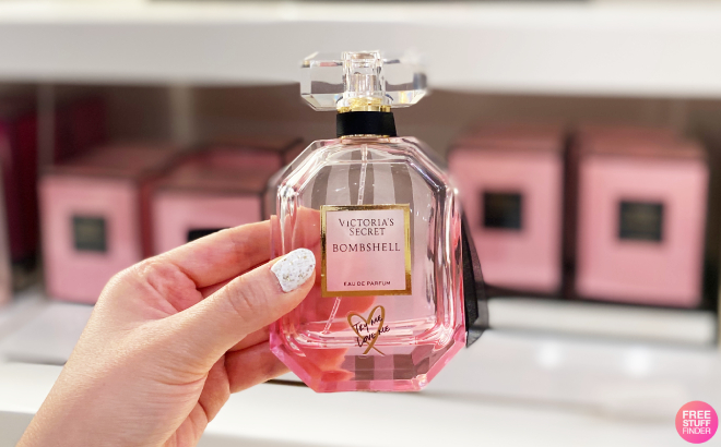 A Person Holding a Bottle of Victorias Secret Bombshell Perfume