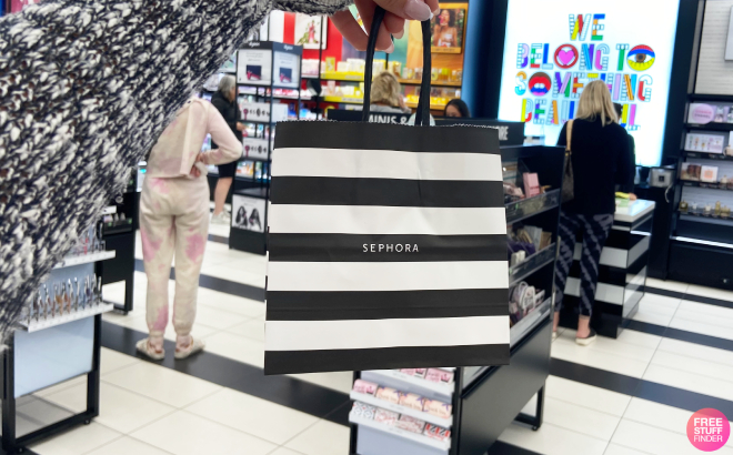 A Person Holding a Sephora Paper Bag in Store