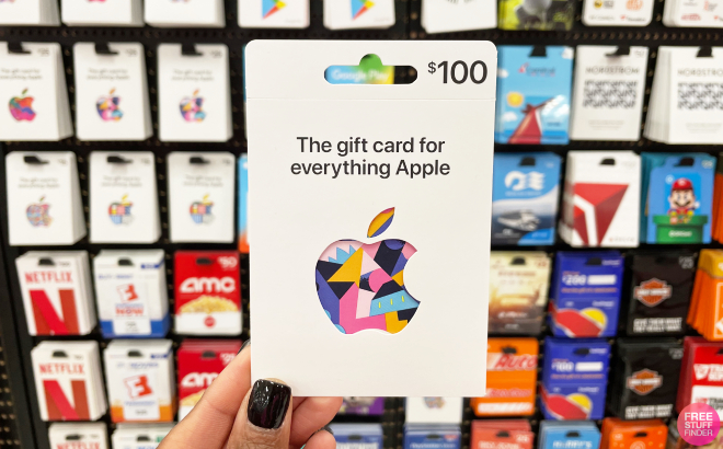A Person Holding an Apple Gift Card A Person Holding an Apple Gift Card
