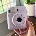 A Person Holding an Instax Camera