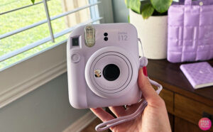 A Person Holding an Instax Camera