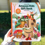 A Person Holding the Amazons Holiday Kids Gift Book 2026
