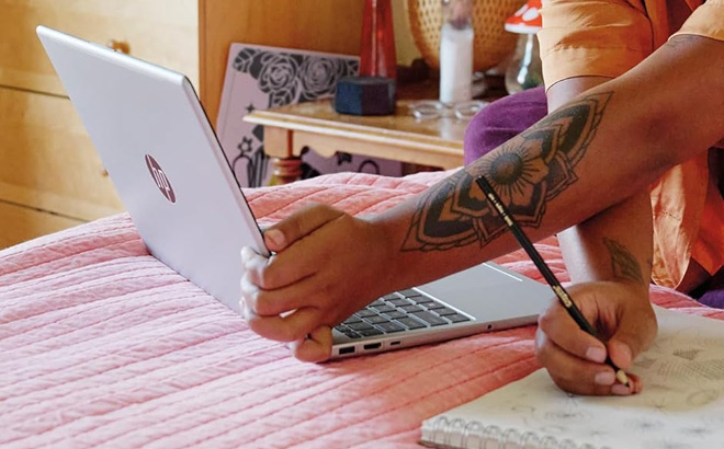 A Person Using HP 15 6 Inch Laptop