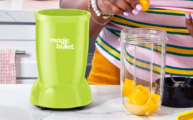 A Person Using Magic Bullet Essential Blender A Person Using Magic Bullet Essential Blender