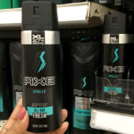 A Woman Holding AXE Deodorant Spray in Apollo Scent