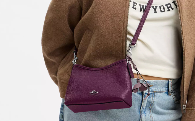A Woman Wearing Coach Outlet Laurel Small Shoulder Bag with Flower Charm