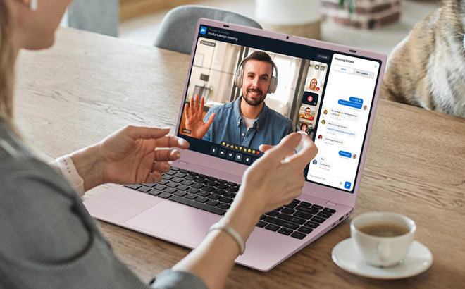 A Person Using a Pink Laptop Computer