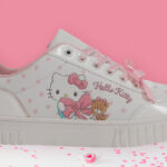 Hello Kitty Friends By Sanrio Womens Black Casual Court Sneaker on the Table