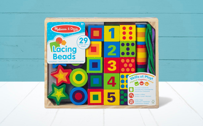 Melissa Doug Deluxe Wooden Lacing Beads on the Table