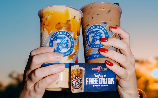 People Holding Two 7Brew Drinks with a Promotion Card